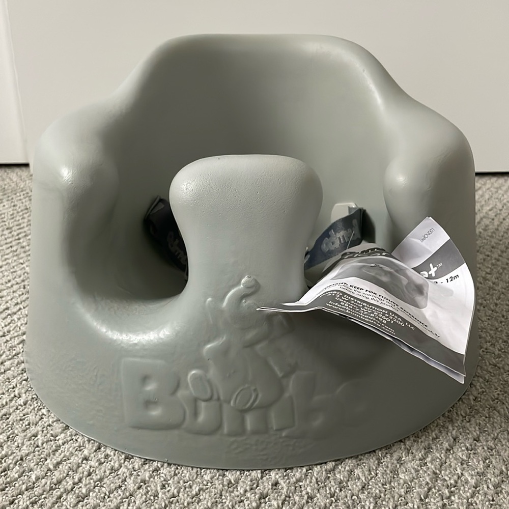 Bumbo gray baby seat. New with tags, never used.